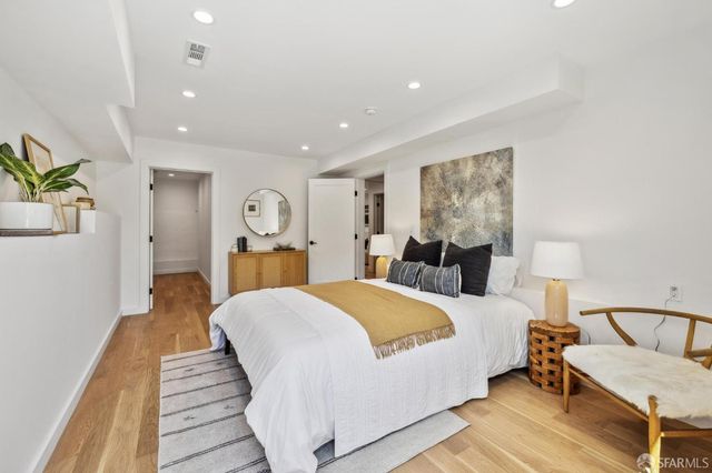 a view of a hallway with wooden floor and a hallway