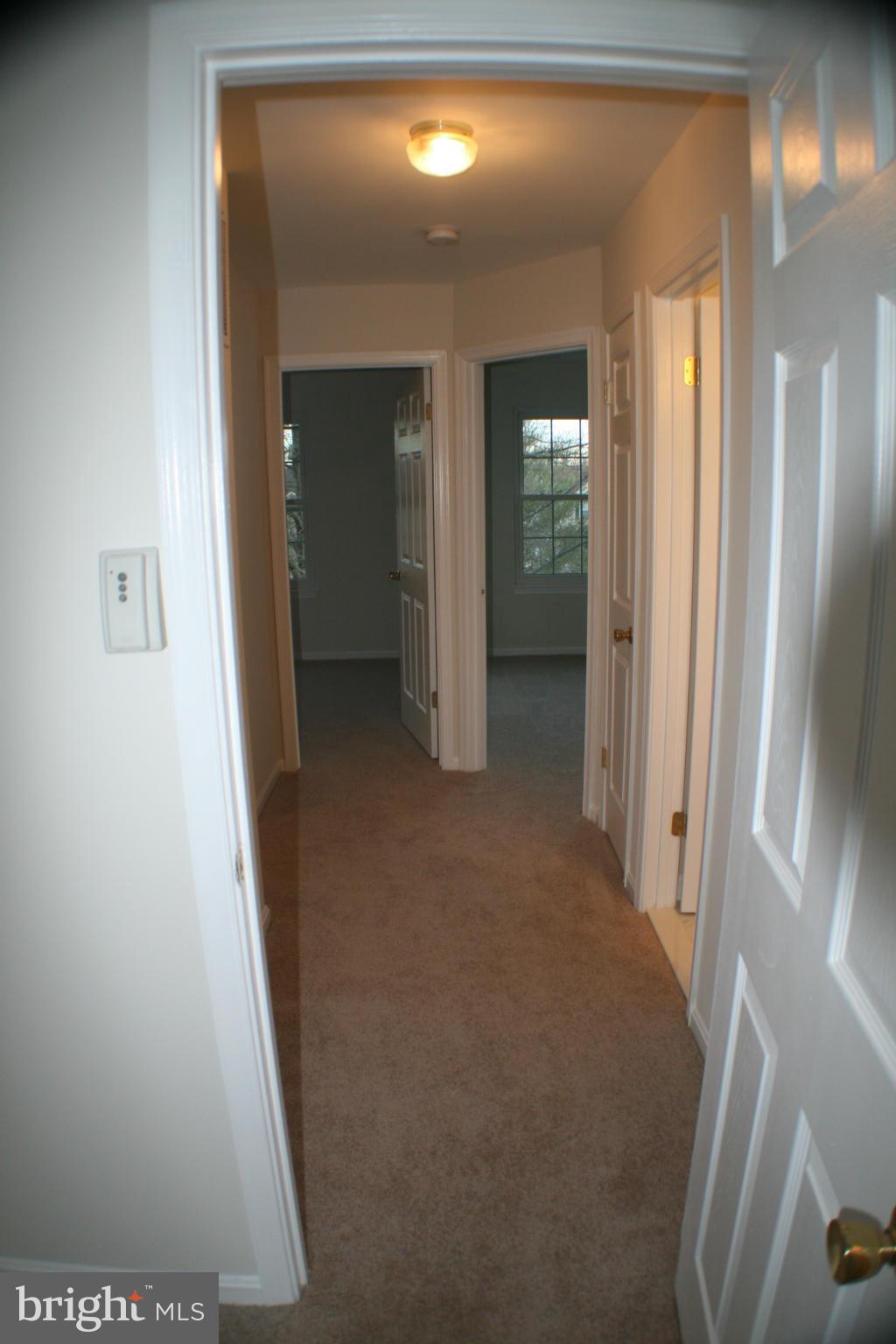 13930 Baton Rouge Court Centreville, VA 20121 - Photo 13 of 26 a view of a hallway with wooden floor