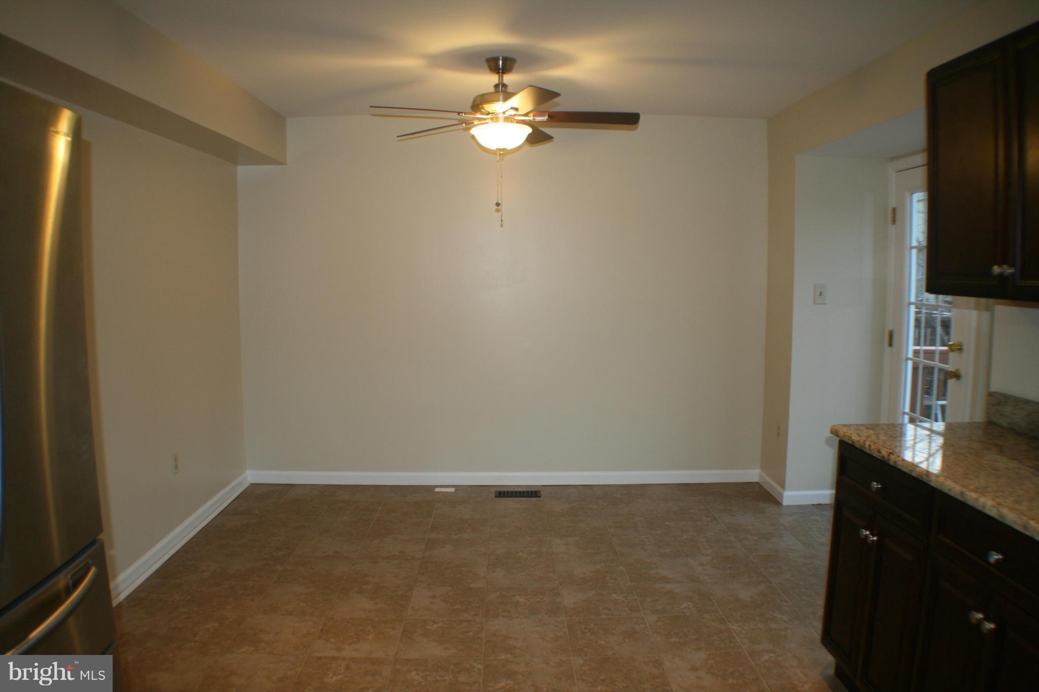 13930 Baton Rouge Court Centreville, VA 20121 - Photo 18 of 26 a view of kitchen and hall with a flat screen tv