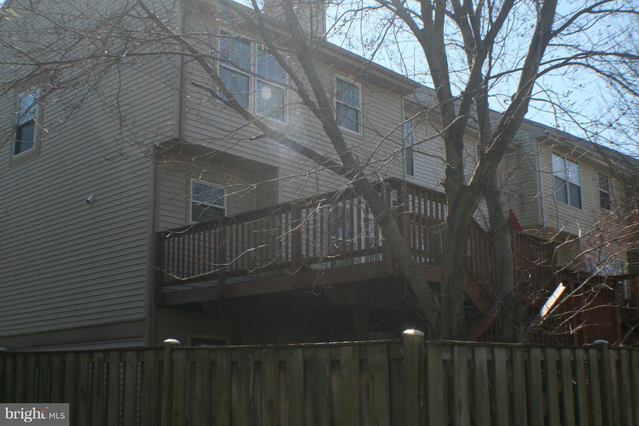 13930 Baton Rouge Court Centreville, VA 20121 - Photo 22 of 26 a view of balcony with wooden floor and fence