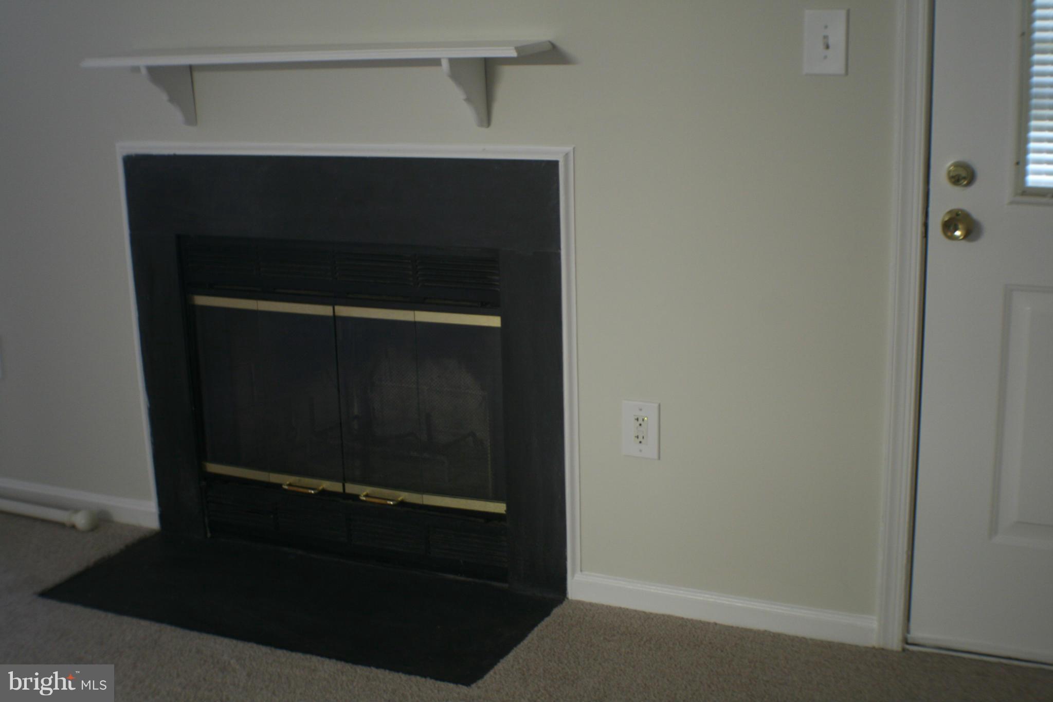 13930 Baton Rouge Court Centreville, VA 20121 - Photo 25 of 26 a living room with a door