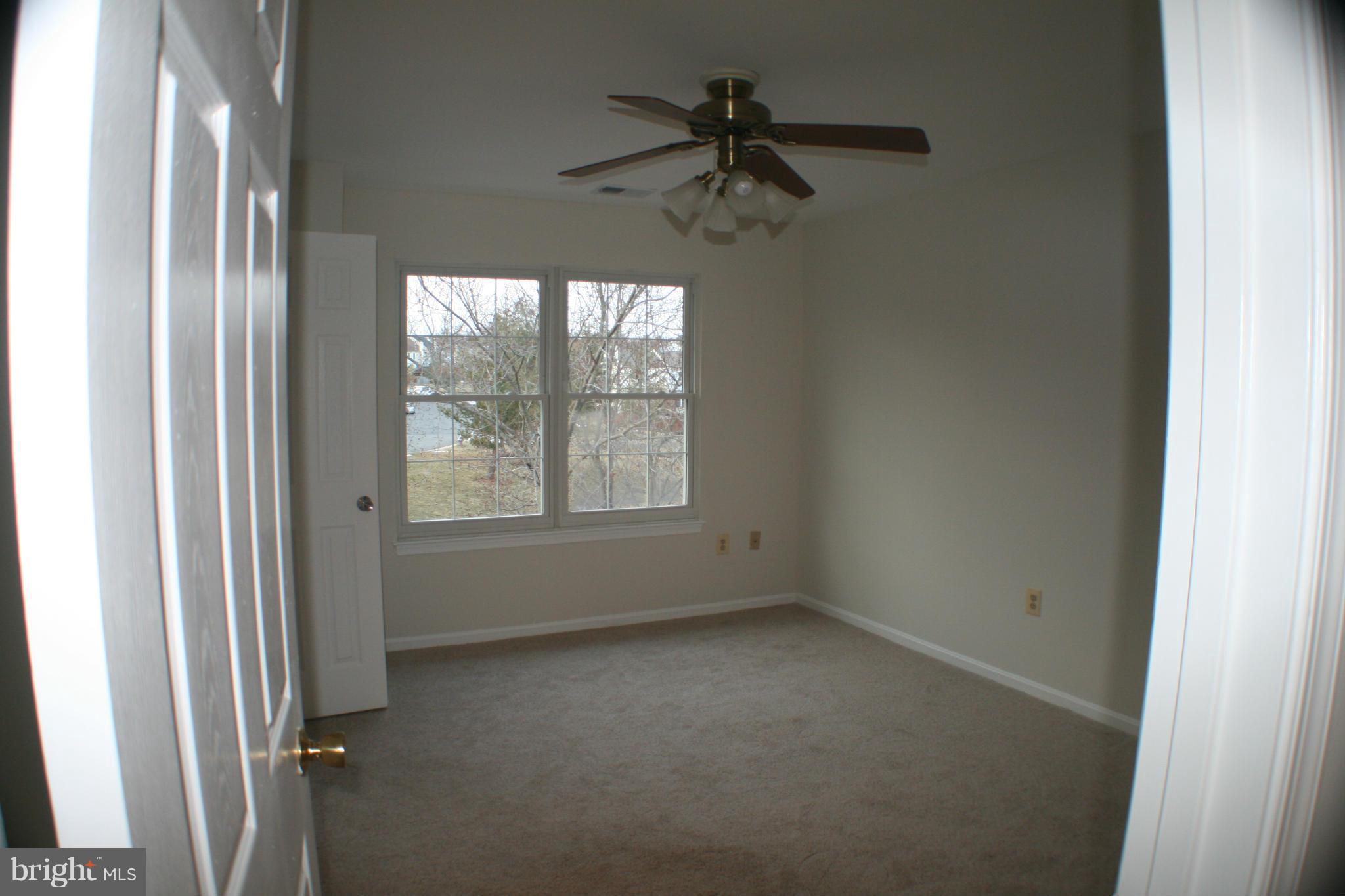13930 Baton Rouge Court Centreville, VA 20121 - Photo 8 of 26 a view of room with window and a ceiling fan