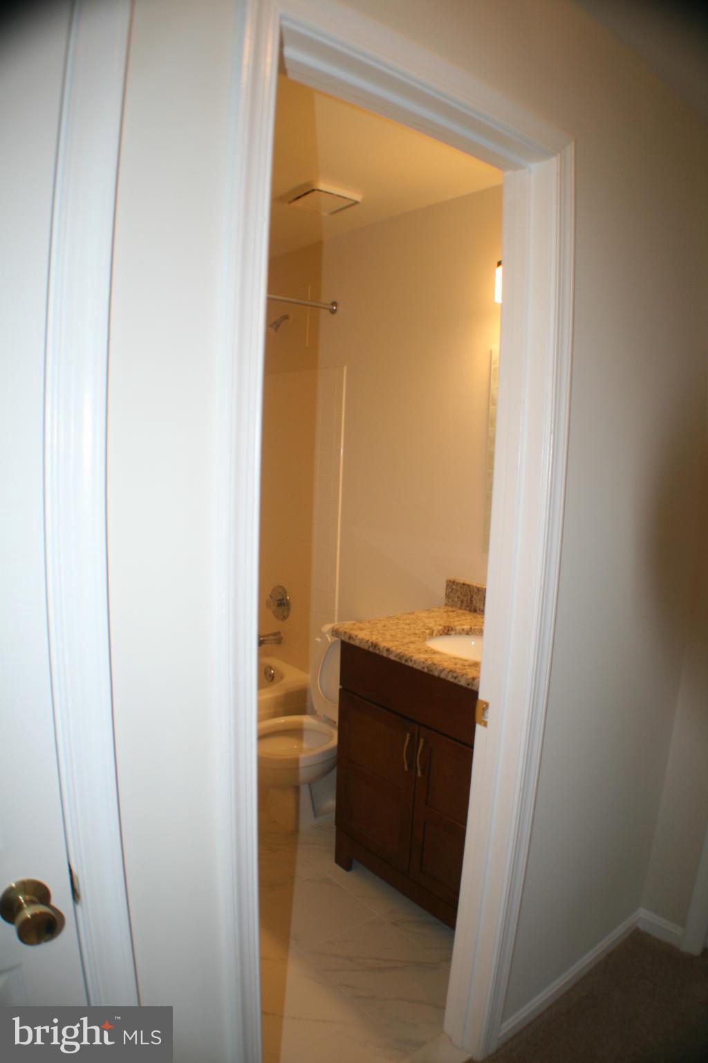 13930 Baton Rouge Court Centreville, VA 20121 - Photo 9 of 26 a bathroom with a sink and a mirror