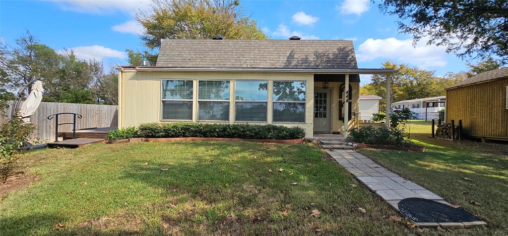 444 Geronimo Quitman, TX 75783 - Photo 1 of 34 a front view of a house with a yard
