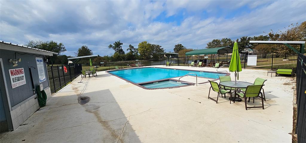 444 Geronimo Quitman, TX 75783 - Photo 31 of 34 a view of swimming pool with outdoor seating and a garden