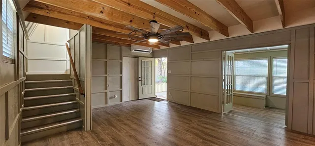 a view of entryway with wooden floor