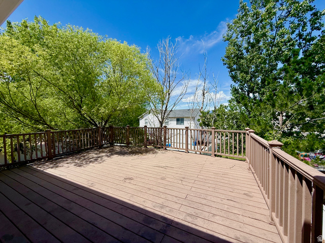 1705 80 East Tooele, UT 84074 - Photo 21 of 22 Spacious exterior deck featuring wood-finish flooring and a full perimeter railing