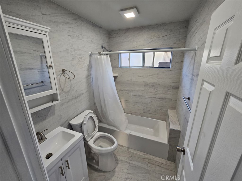 3427 Bell Avenue Bell, CA 90201 - Photo 12 of 12 a bathroom with a sink toilet and shower