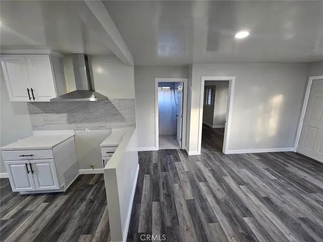 a view of a livingroom with wooden floor