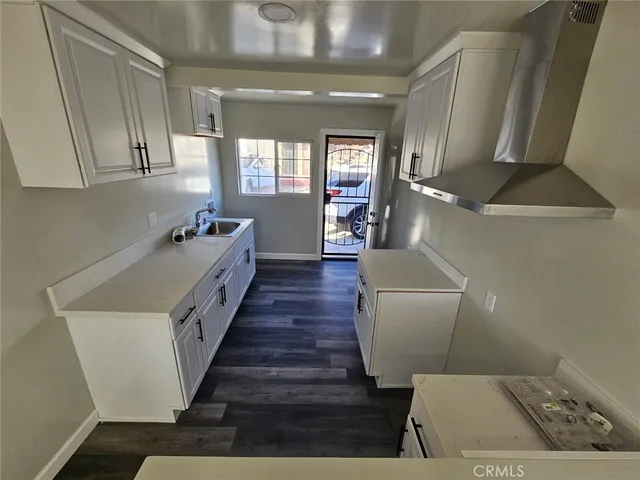 a room with furniture and wooden floor