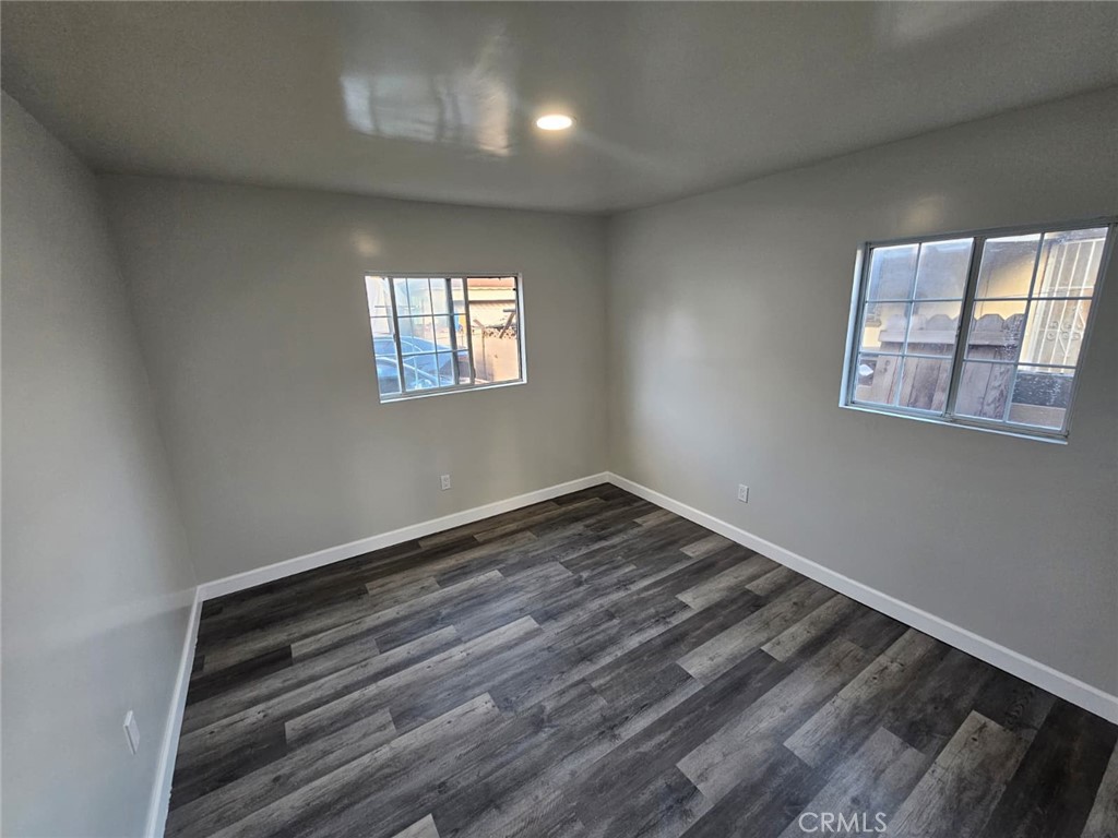 3427 Bell Avenue Bell, CA 90201 - Photo 10 of 12 a view of empty room with wooden floor