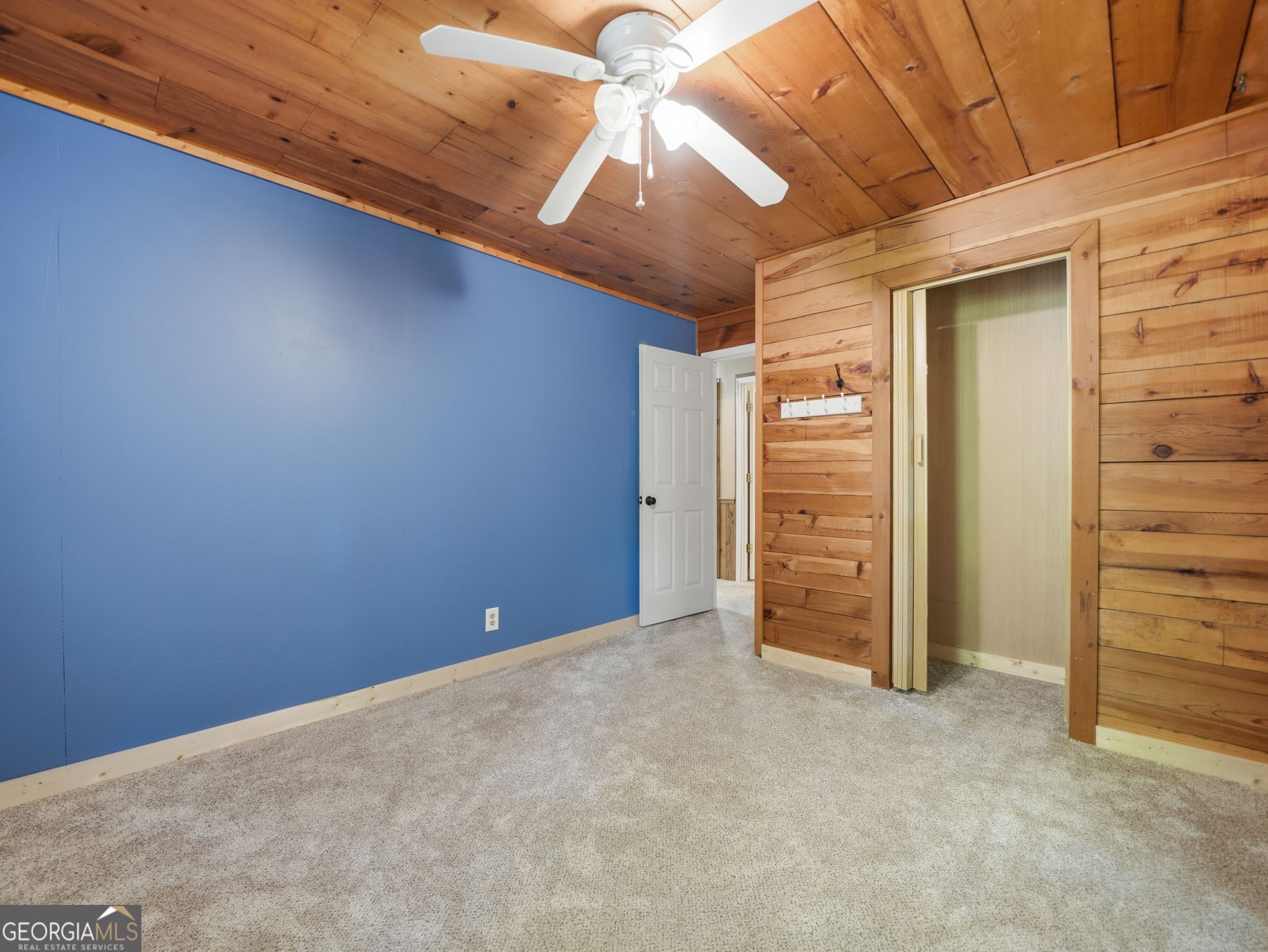 629 Goose Island Road Cherry Log, GA 30522 - Photo 15 of 52 a view of an empty room with a ceiling fan