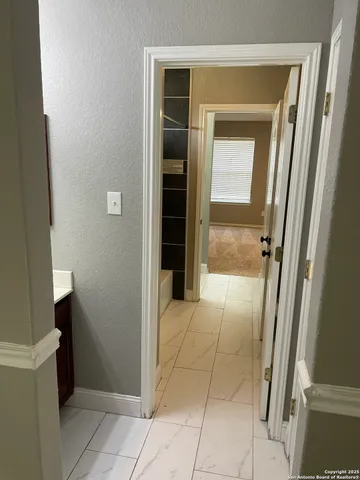 a view of a room with racks on the wall