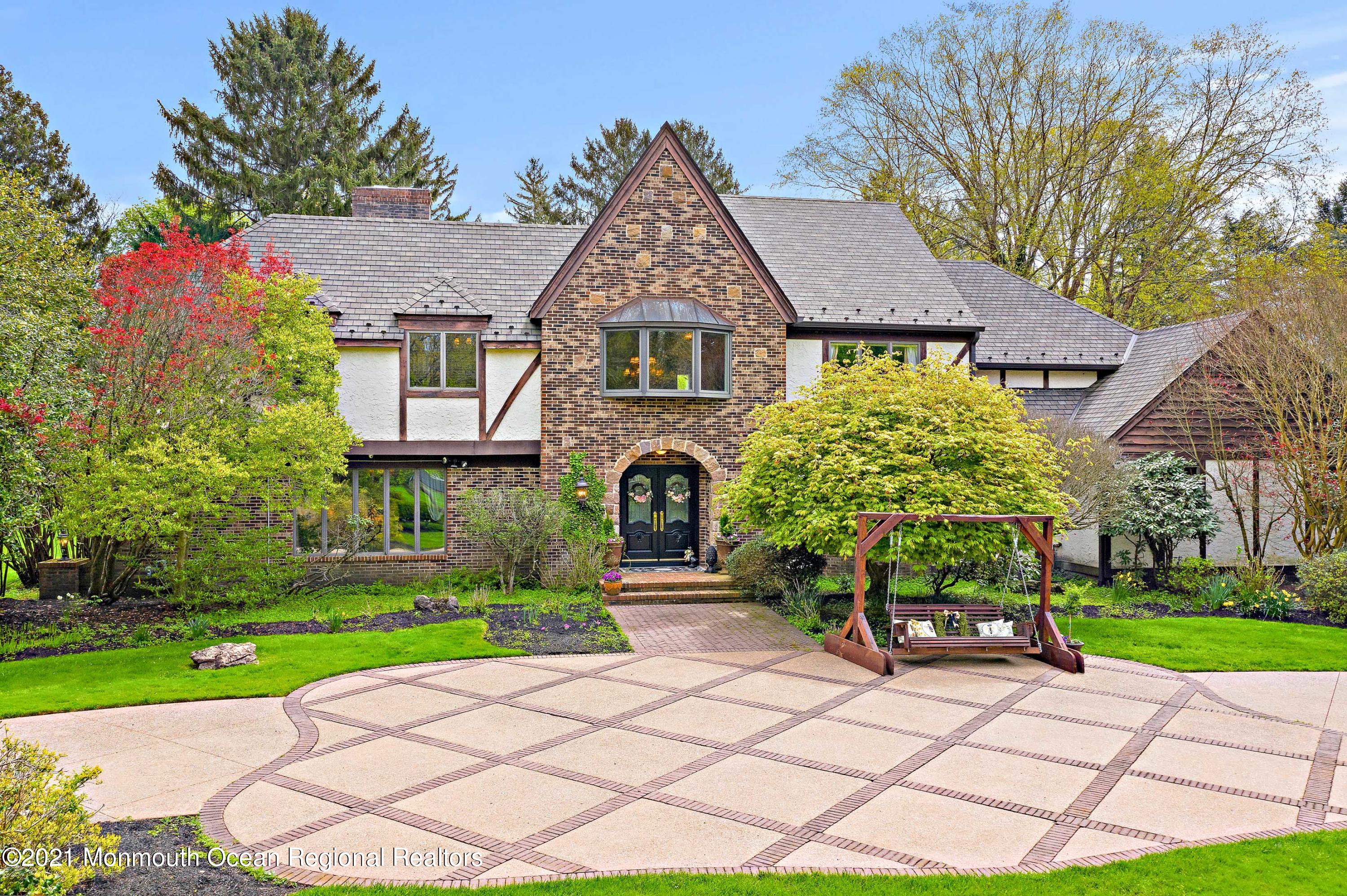 5 Post Road Rumson, NJ 07760 - Photo 1 of 67 a front view of a house with a yard