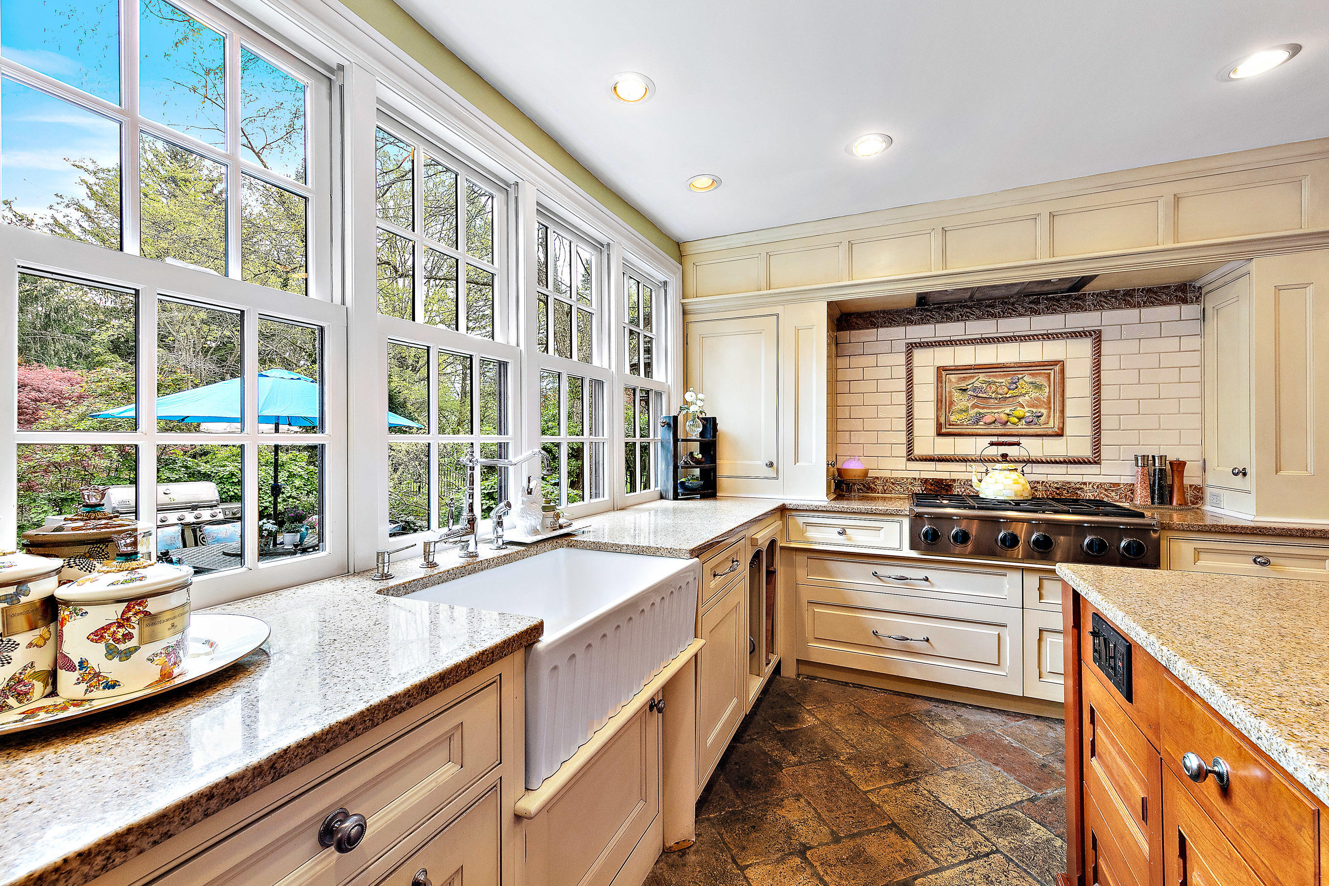 5 Post Road Rumson, NJ 07760 - Photo 14 of 67 a kitchen with stainless steel appliances granite countertop a stove and more cabinets