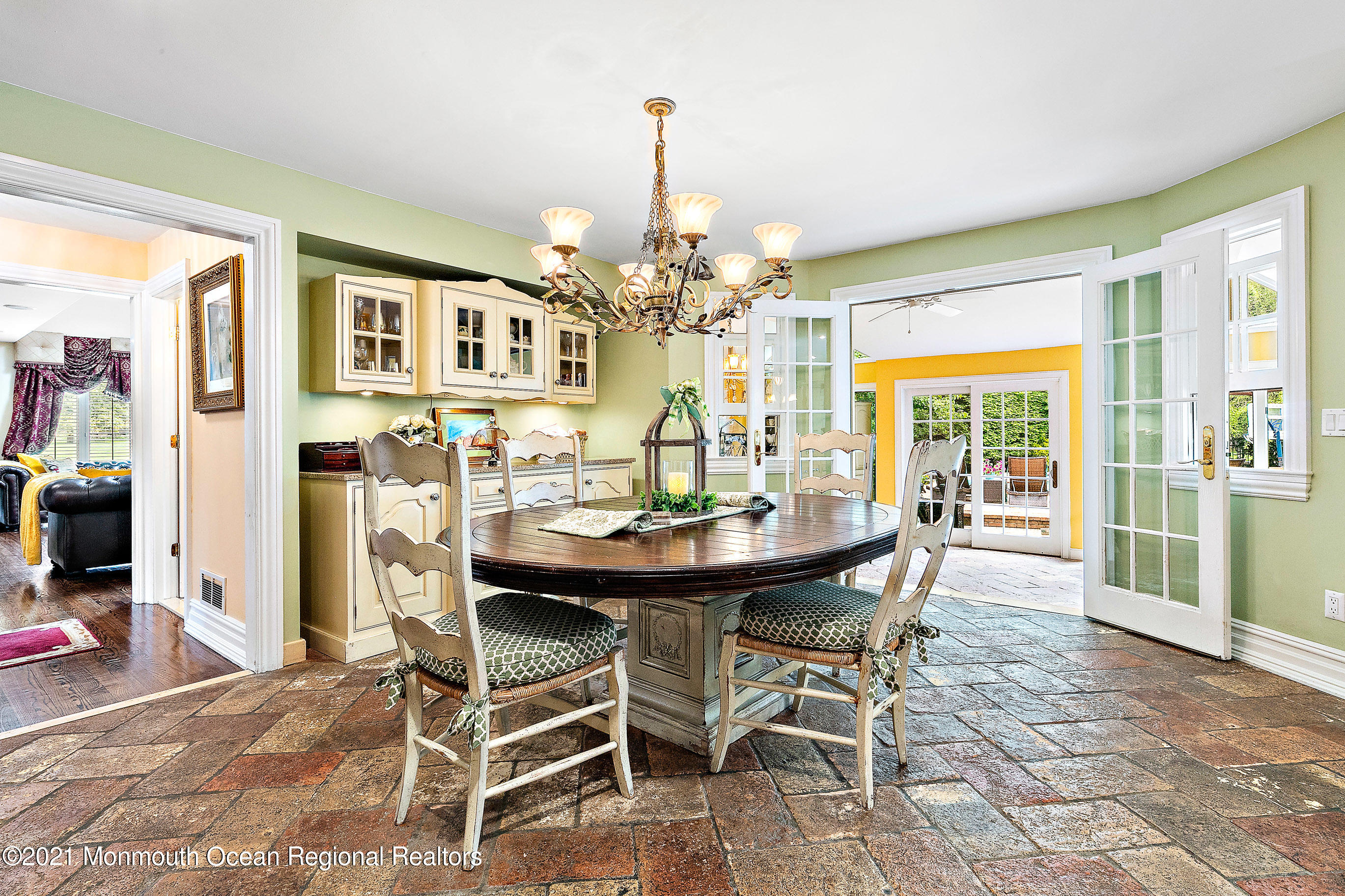 5 Post Road Rumson, NJ 07760 - Photo 17 of 67 a view of a dining room with furniture and a chandelier