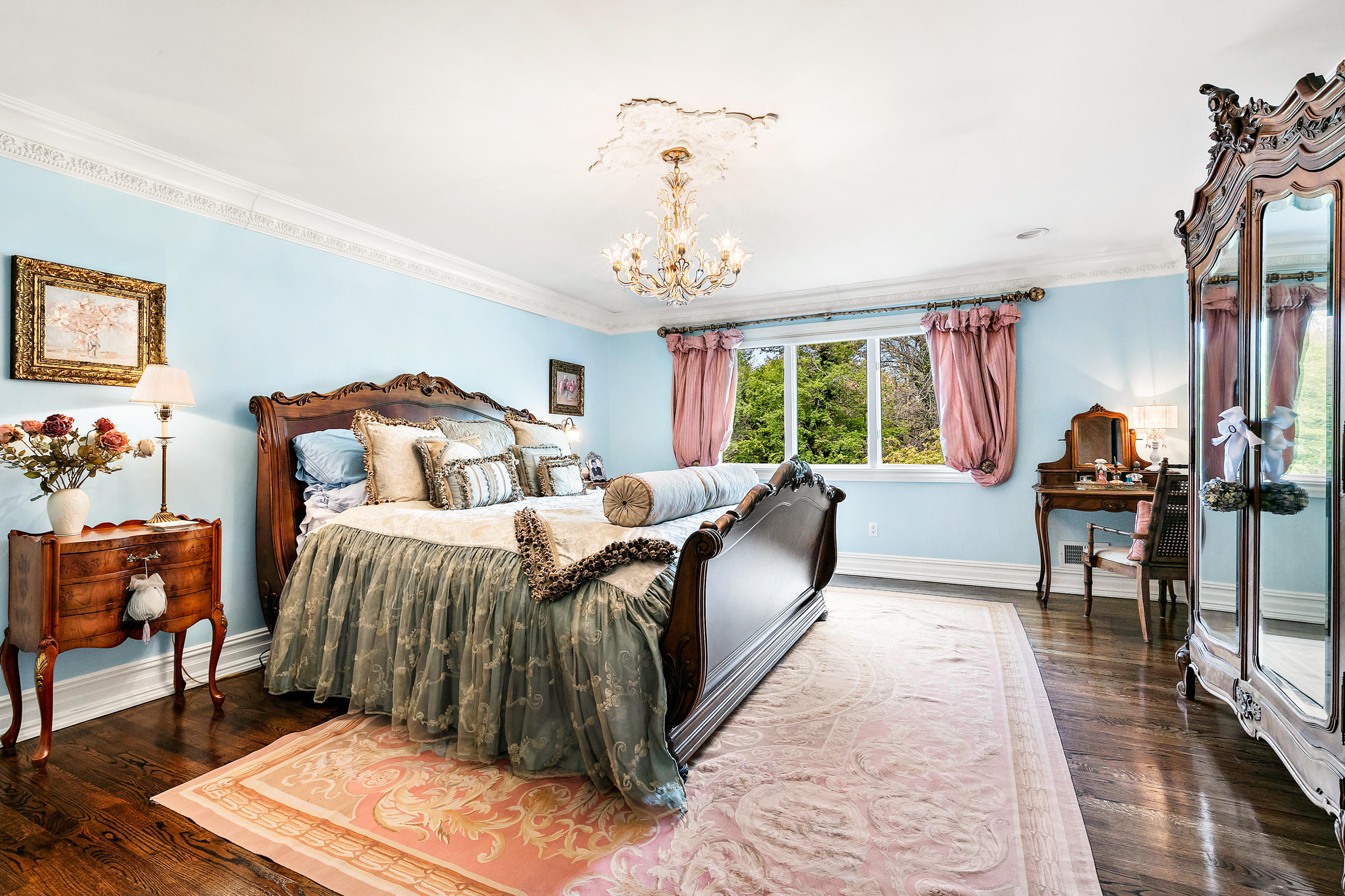 5 Post Road Rumson, NJ 07760 - Photo 25 of 67 a bedroom with a bed and a chandelier