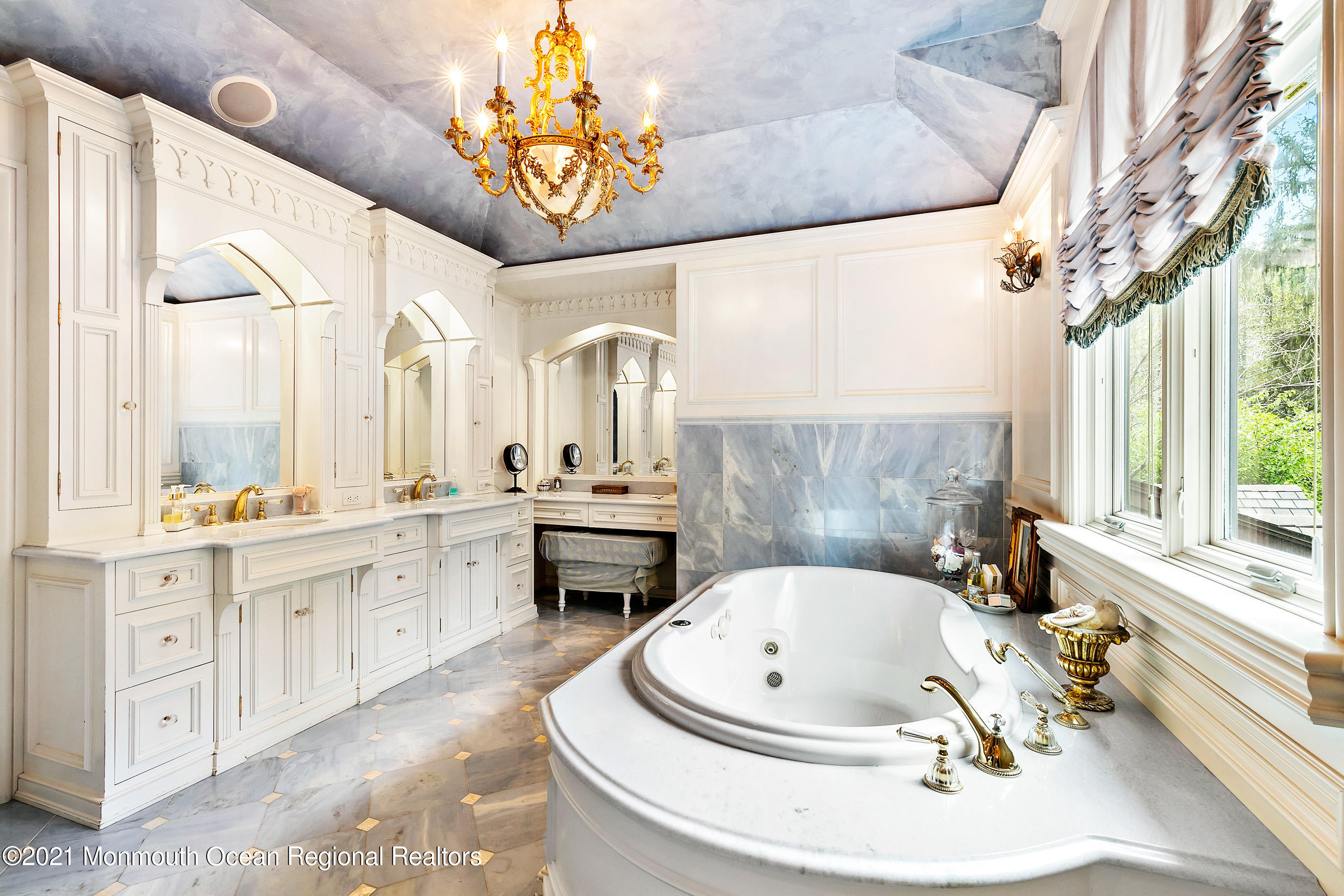 5 Post Road Rumson, NJ 07760 - Photo 26 of 67 a bathroom with a tub a sink and a large window