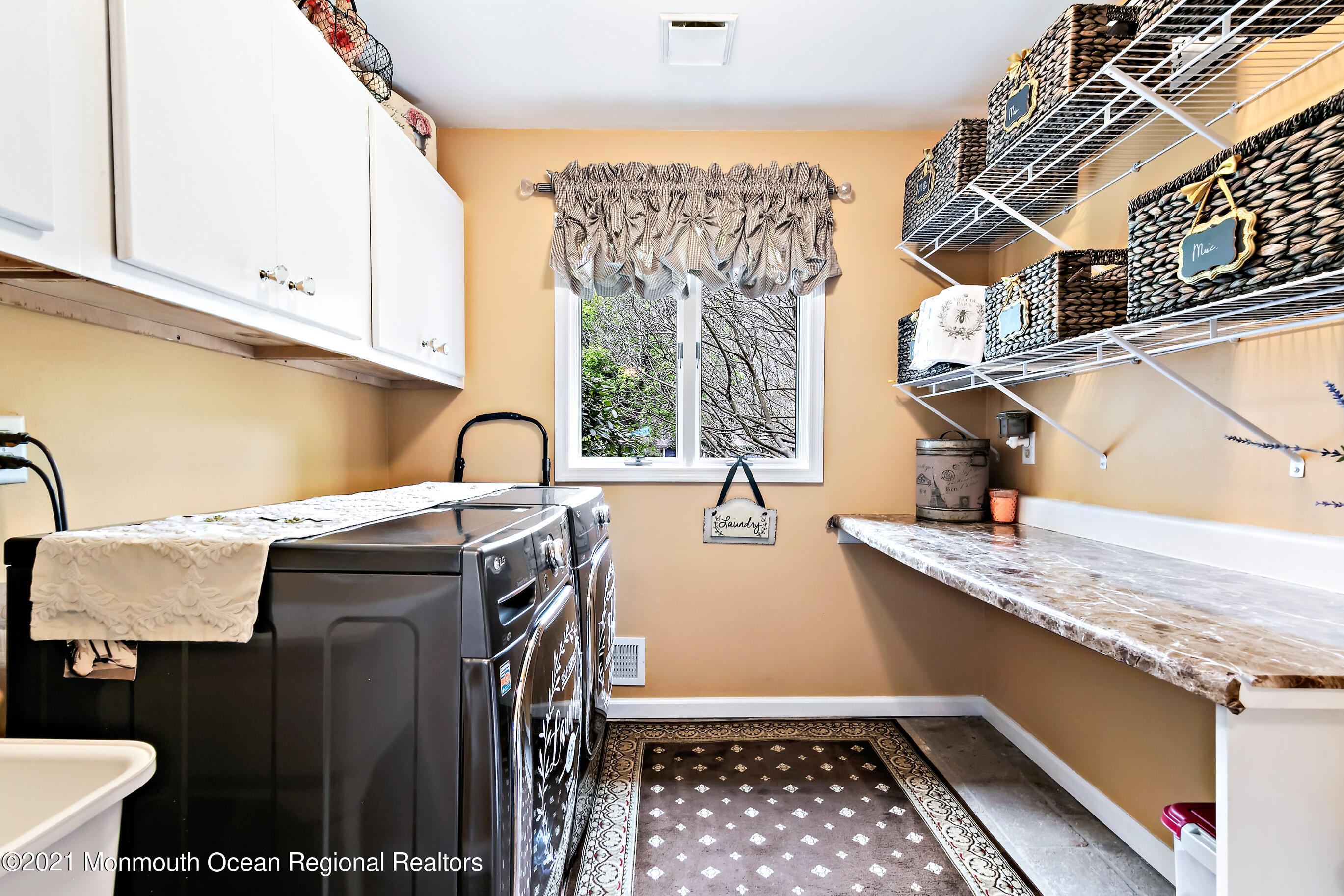 5 Post Road Rumson, NJ 07760 - Photo 39 of 67 a kitchen with a sink a stove and cabinets