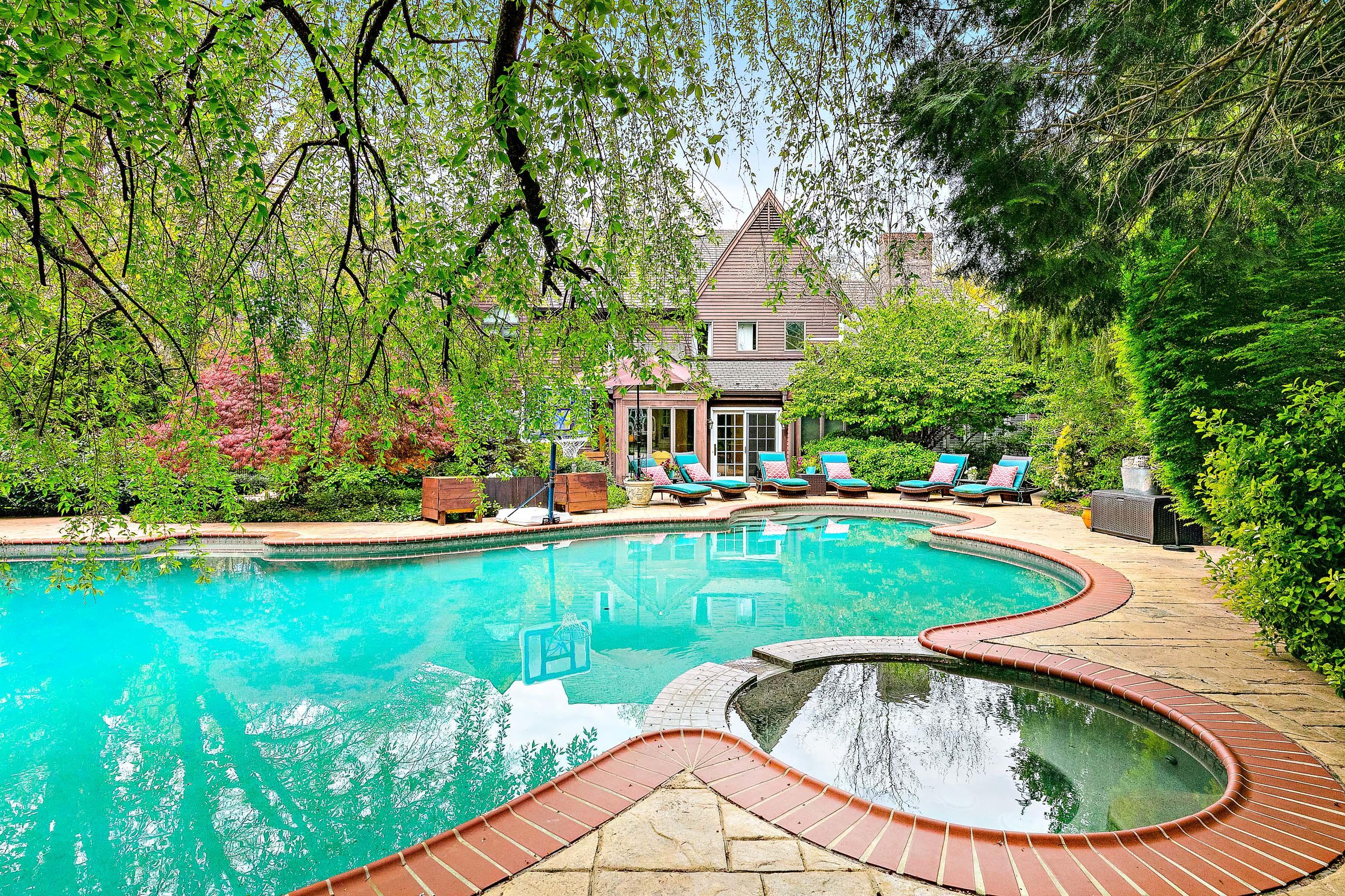 5 Post Road Rumson, NJ 07760 - Photo 50 of 67 a view of a house with swimming pool and a small yard