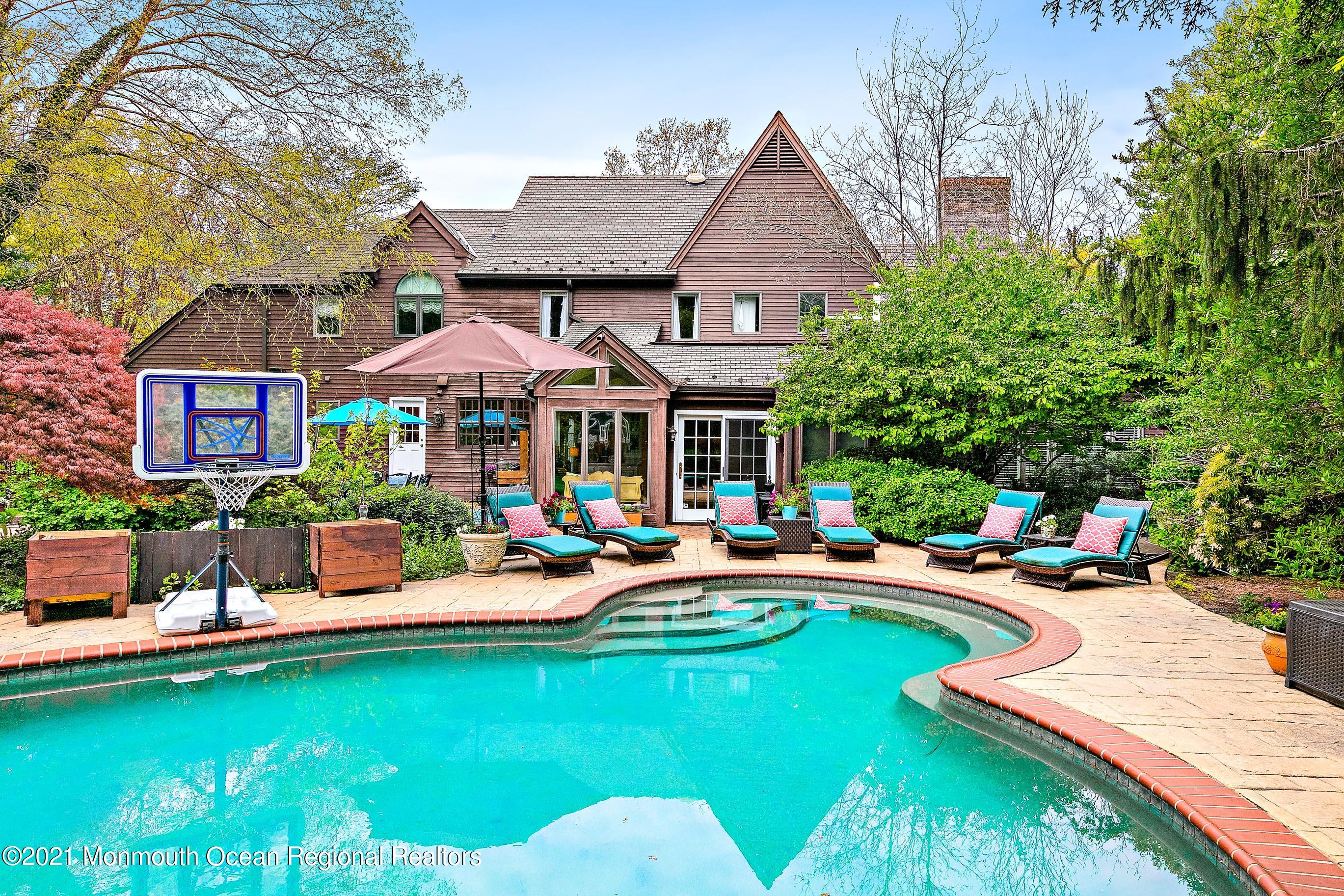 5 Post Road Rumson, NJ 07760 - Photo 51 of 67 a front view of a house with swimming pool garden and patio