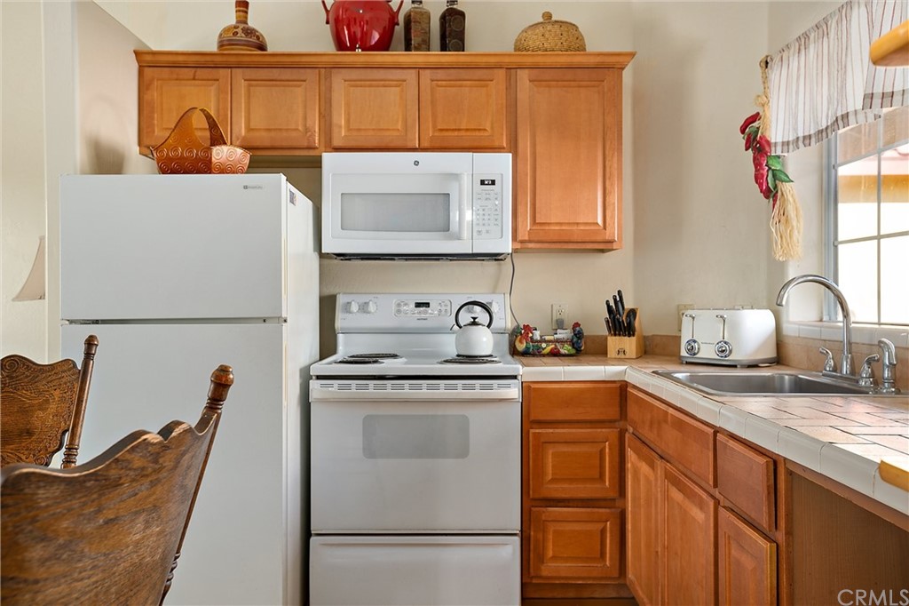 4295 Union Road Paso Robles, CA 93446 - Photo 17 of 39 a kitchen with stainless steel appliances granite countertop a sink stove and cabinets