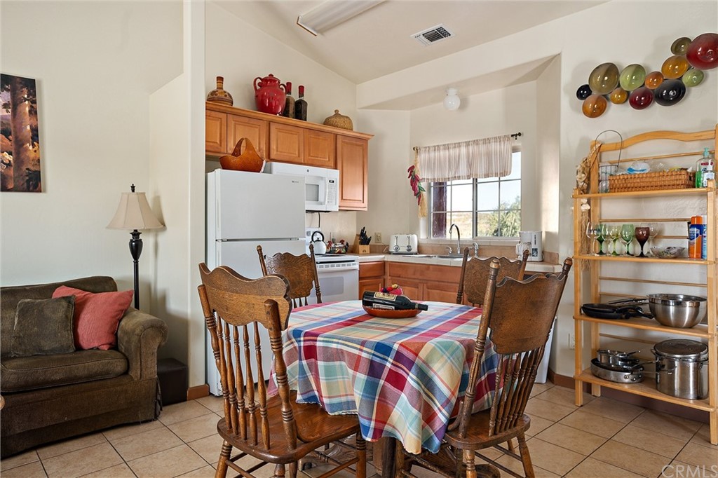 4295 Union Road Paso Robles, CA 93446 - Photo 19 of 39 a living room with furniture and a kitchen area