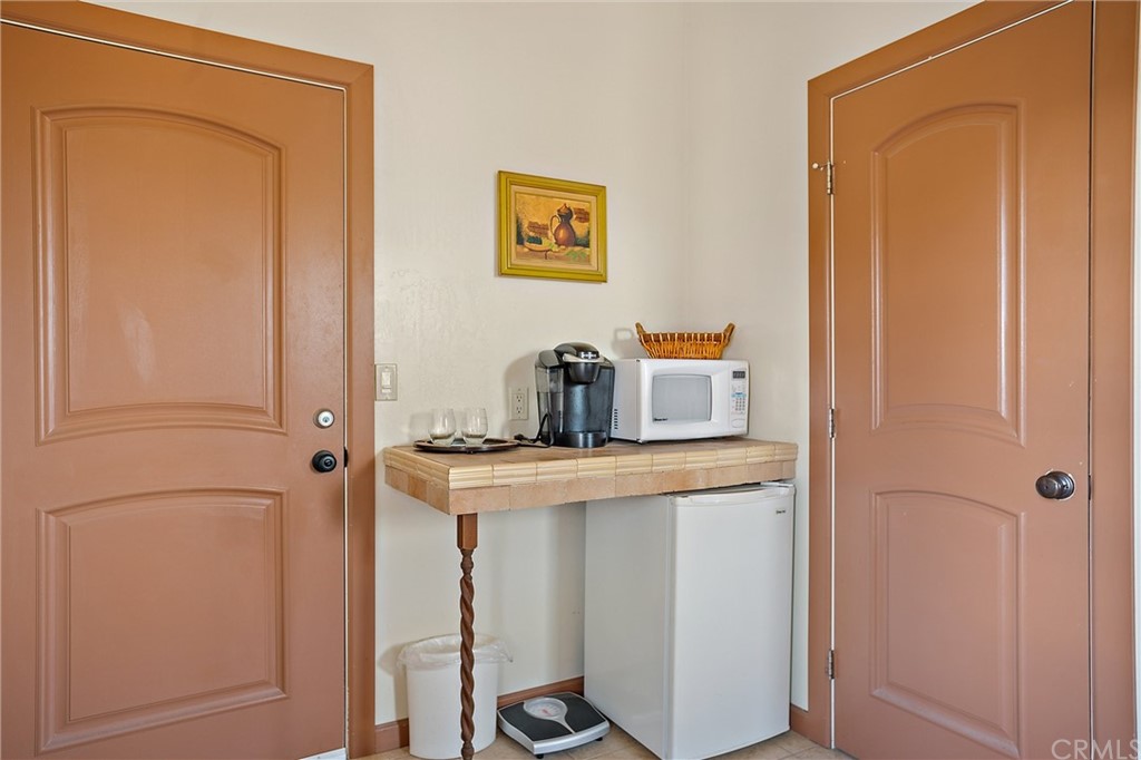 4295 Union Road Paso Robles, CA 93446 - Photo 28 of 39 a kitchen with a refrigerator and cabinets