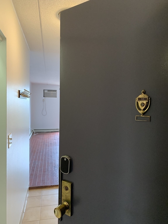301 Lowell Street, Unit 34 Somerville, MA 02145 - Photo 2 of 15 a view of hallway with shower