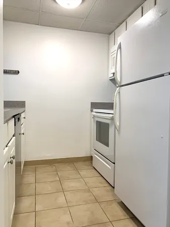 a view of a storage and utility room with washer and dryer