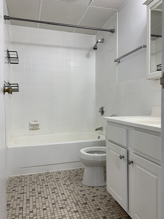 301 Lowell Street, Unit 34 Somerville, MA 02145 - Photo 9 of 15 a bathroom with a toilet a sink and bathtub