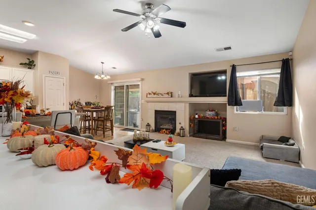 a living room with furniture fireplace and flat screen tv
