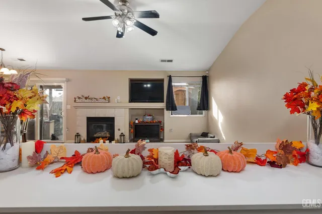 a living room with furniture toys and a fireplace