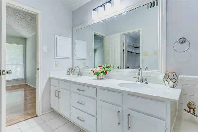 a bathroom with a sink and a window