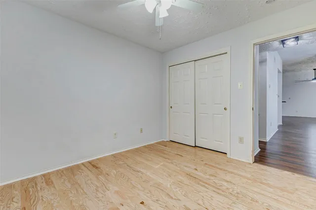 a bathroom with a sink vanity mirror and toilet