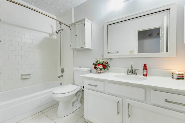 a view of a house with a large tree and a big yard