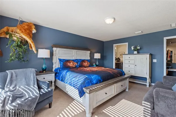 a bed room with a bed and a couch