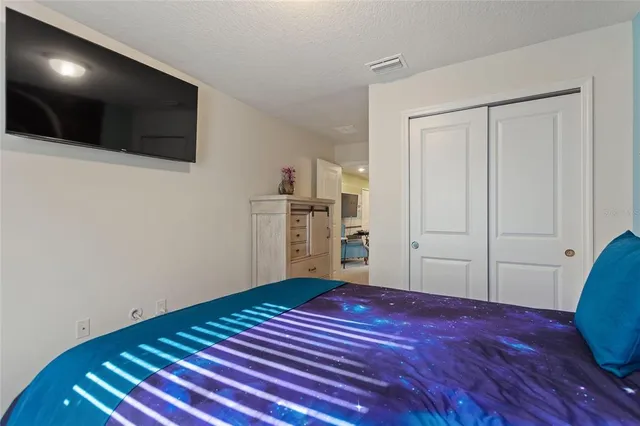 a bedroom with furniture and window