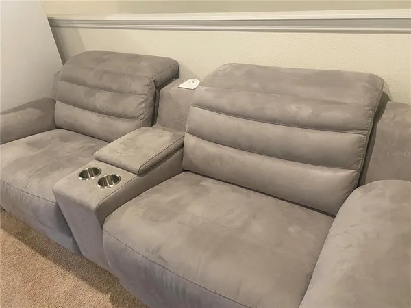 a living room with furniture and a couch