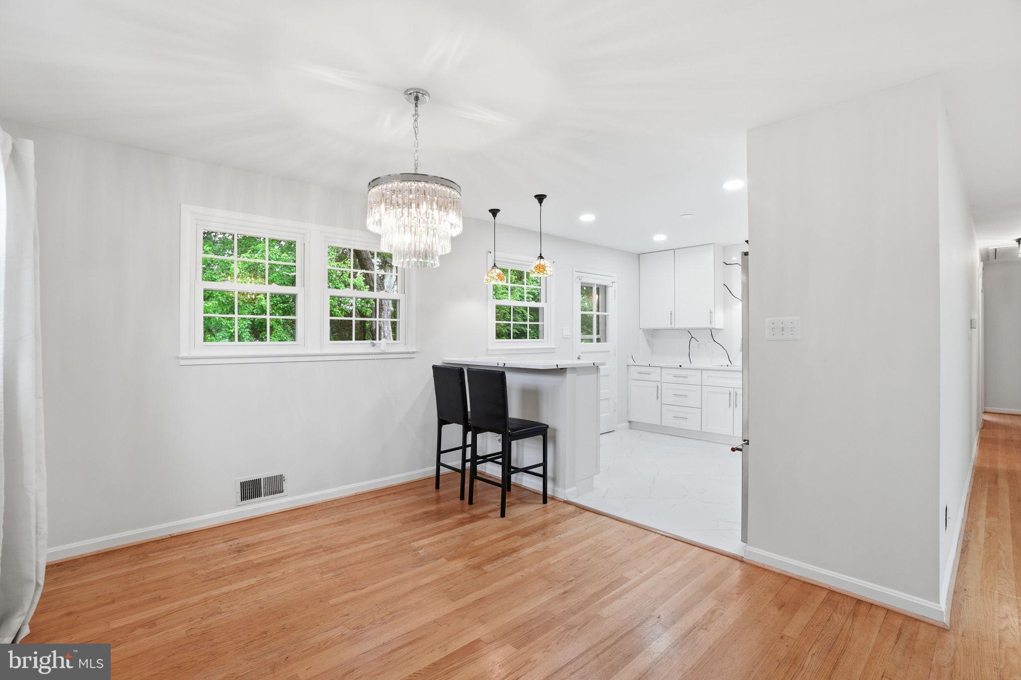 5304 Pillow Lane Springfield, VA 22151 - Photo 7 of 32 a view of a room with wooden floor windows and entryway