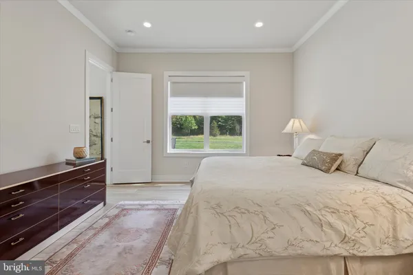 a large white bed in a white room
