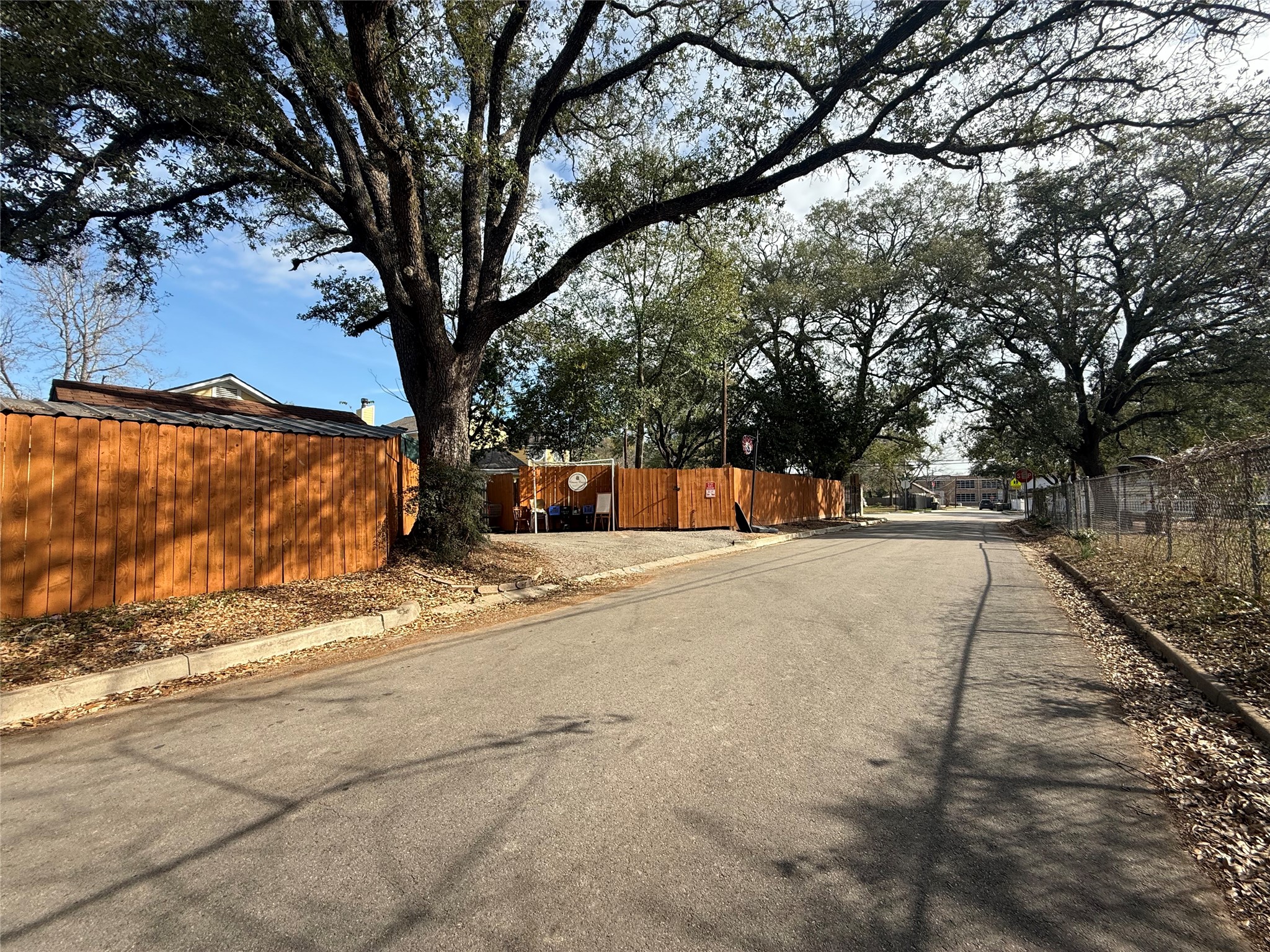 412 Waco Street Conroe, TX 77301 - Photo 36 of 50 a view of road with a covered with tall trees