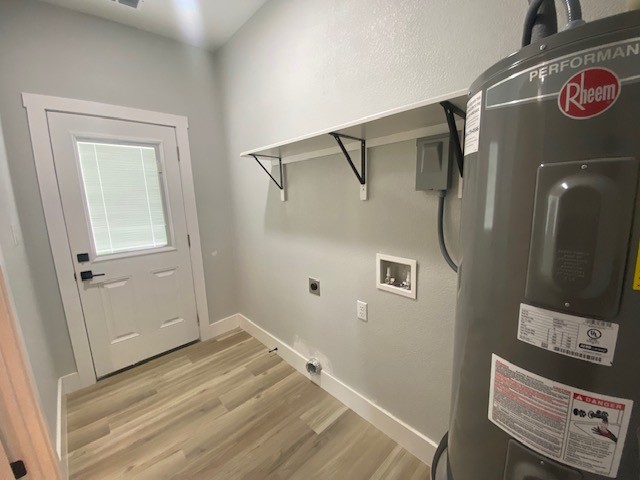 116 Field Street Luling, TX 78648 - Photo 11 of 33 A well-organized utility space awaits your personal touch with light wood-style flooring.