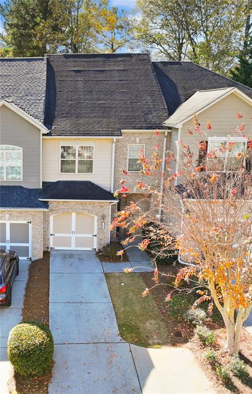 138 Trailside Way Hiram, GA 30141 - Photo 31 of 35 a view of a patio with table and chairs potted plants