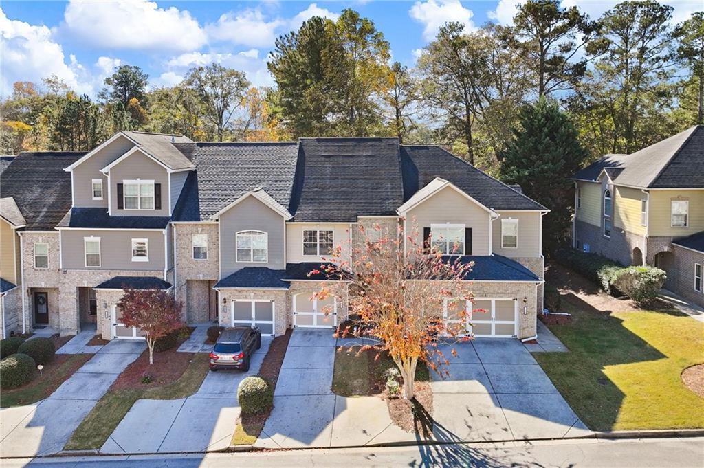 138 Trailside Way Hiram, GA 30141 - Photo 33 of 35 a view of house with wooden floor and outdoor seating