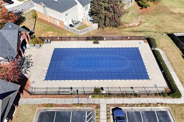 a view of a patio with a table and chairs