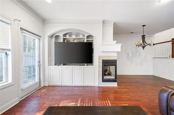 a view of a livingroom with furniture and a fireplace