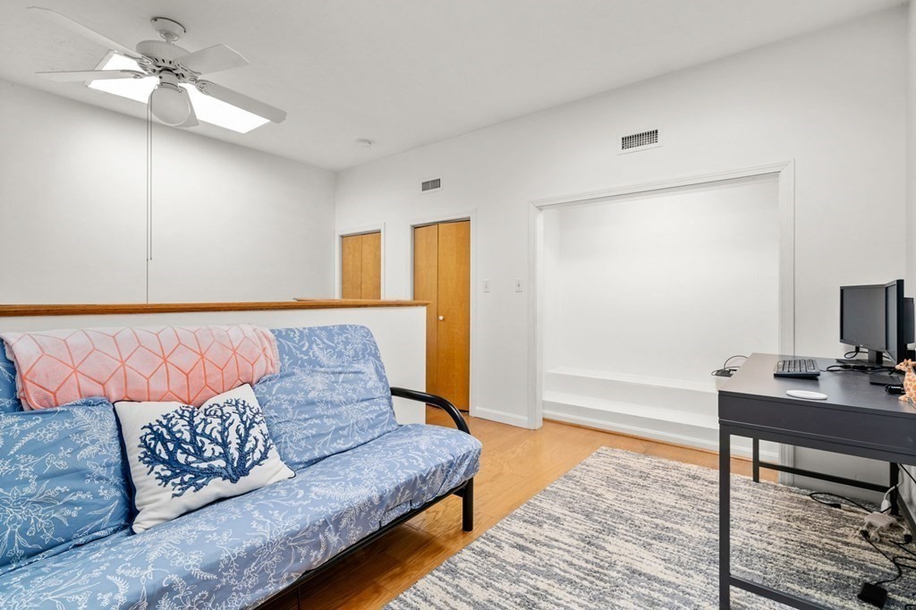 53 South Walnut Street, Unit 2 Quincy, MA 02169 - Photo 18 of 24 a living room with couch and a rug