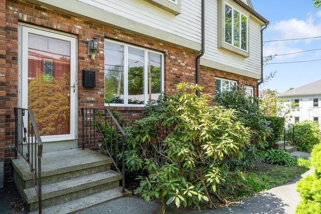 53 South Walnut Street, Unit 2 Quincy, MA 02169 - Photo 23 of 24 a view of a building with garden