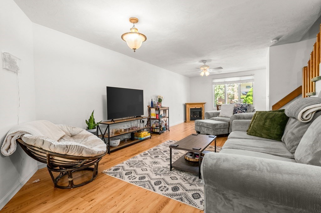 53 South Walnut Street, Unit 2 Quincy, MA 02169 - Photo 6 of 24 a living room with furniture and a flat screen tv